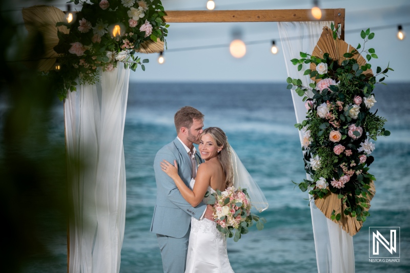Couple shares a moment during their wedding ceremony at Playa Hunku in Curacao