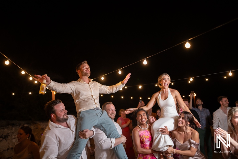 Wedding celebration at Playa Hunku in Curacao with guests enjoying the night