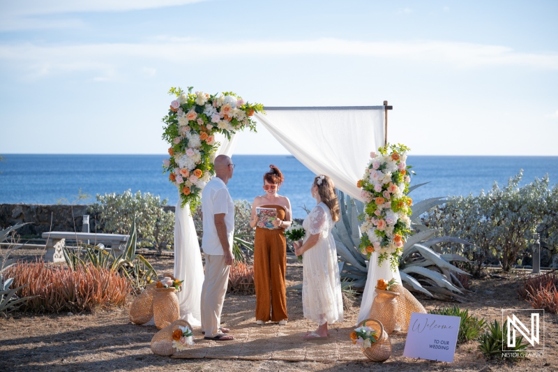 Wedding ceremony takes place in Westpunt Curacao by the ocean under bright sky