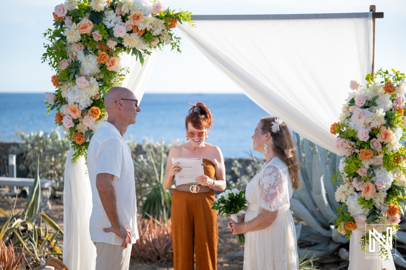 Wedding ceremony in Westpunt Curacao with couple and officiant near the ocean