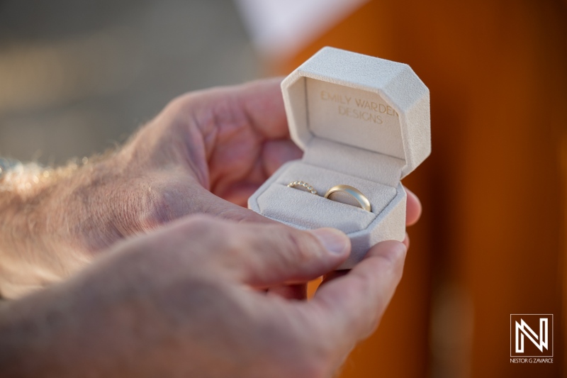 Celebration of love with wedding rings at a venue in Westpunt Curacao during a sunset ceremony
