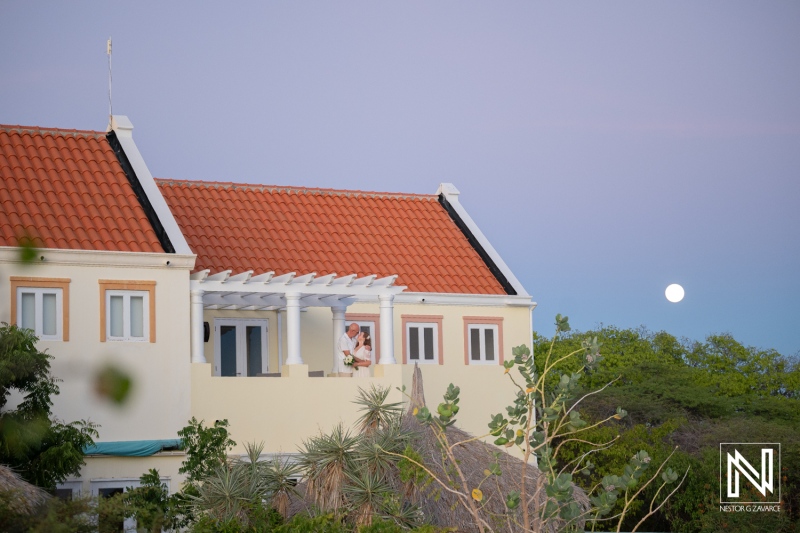 Wedding ceremony takes place at a venue in Westpunt Curacao during a clear evening with a visible moon
