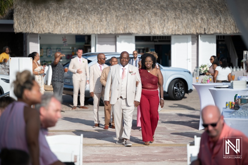 Guests arrive at the wedding ceremony at Karakter in Curacao with festive atmosphere and joyful expressions