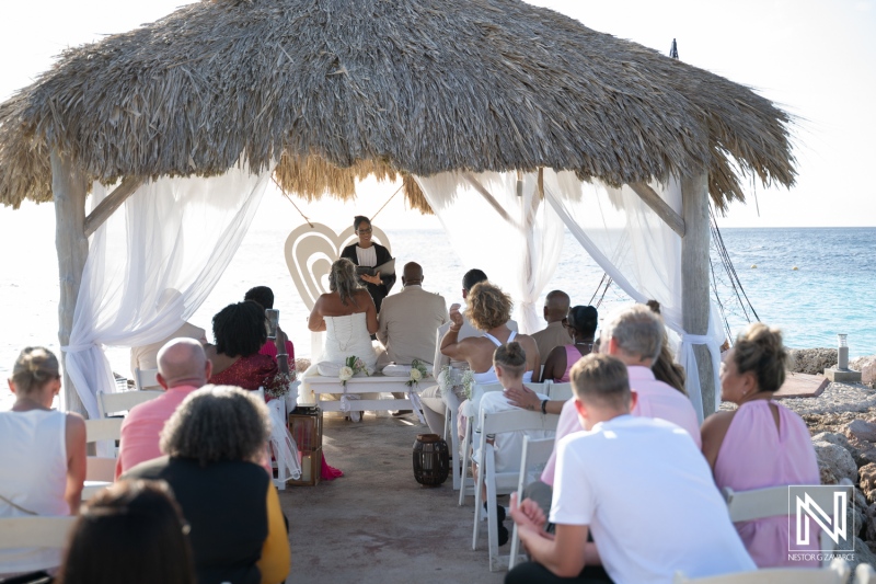 Wedding ceremony at Karakter in Curacao near the ocean with guests in attendance