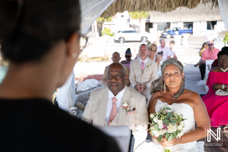 Wedding ceremony at Karakter in Curacao with guests witnessing the vows