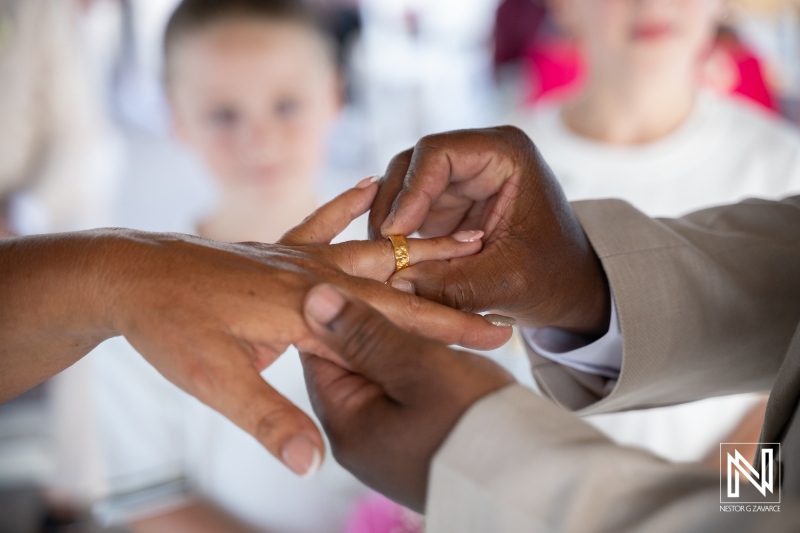 Couple exchanges rings during wedding ceremony at Karakter in Curacao