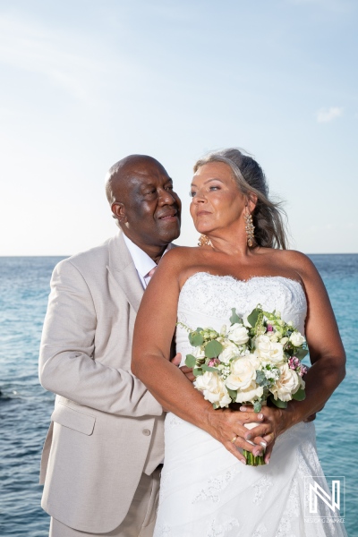 Couple celebrates their wedding at Karakter in Curacao by the sea in a joyful moment