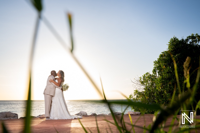 Couple celebrates wedding at Karakter in Curacao during sunset with beautiful ocean view