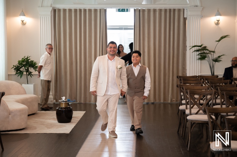 Wedding celebration at Avila Beach Hotel with groom and boy walking down the aisle