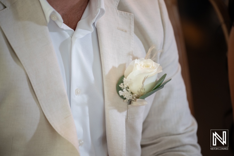 Wedding celebration at Avila Beach Hotel in Curacao with focus on groom's attire