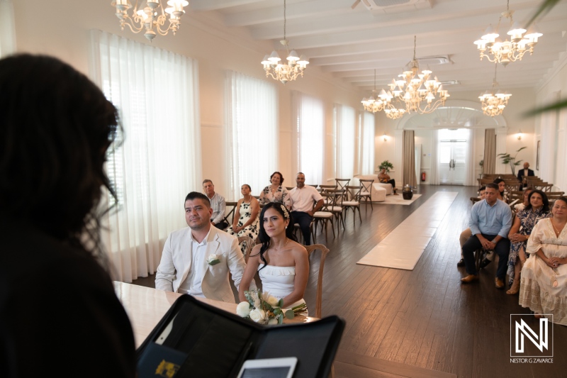Wedding ceremony at Avila Beach Hotel in Curacao with guests and couple