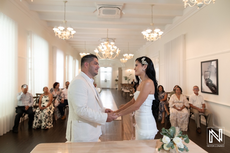 Wedding ceremony taking place at Avila Beach Hotel with guests seated and couple exchanging vows