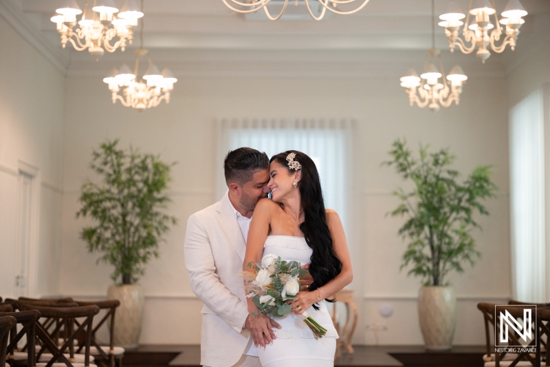 Couple celebrates wedding at Avila Beach Hotel with love and joy in a beautiful indoor setting