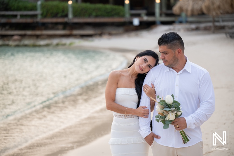 Couple enjoys wedding moment at Avila Beach Hotel in Curacao during sunset
