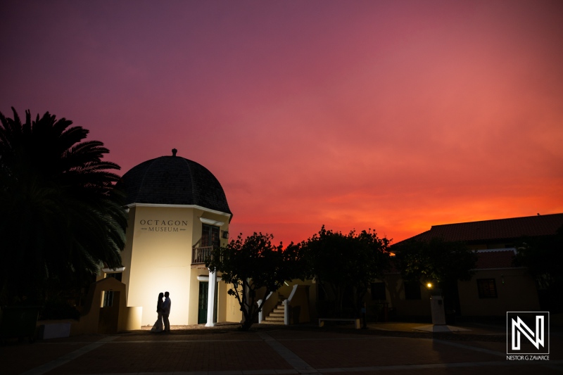 Couple enjoys sunset at Avila Beach Hotel during their wedding celebration in Curacao