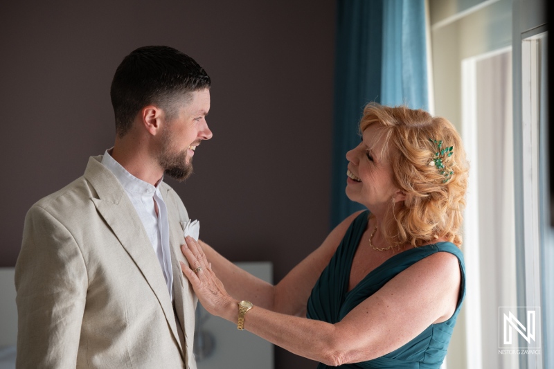 Groom and mother share a heartfelt moment before wedding at Karakter in Curacao