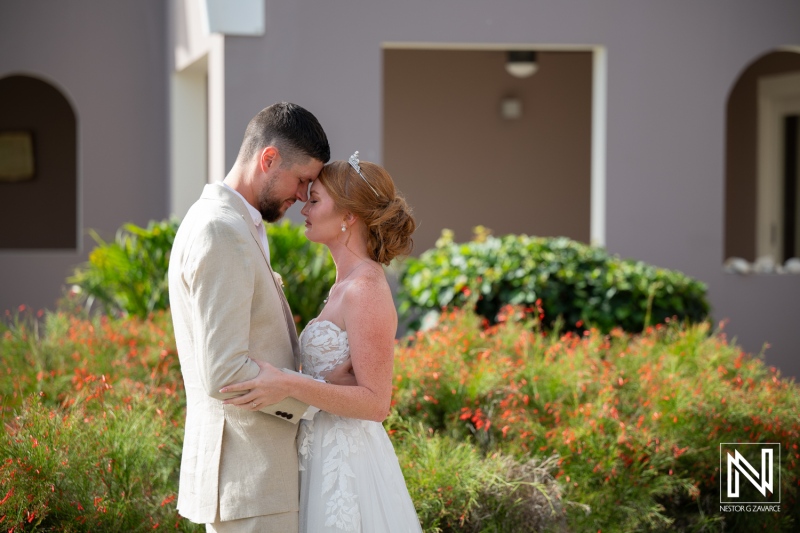 Wedding couple shares a romantic moment outdoors at Karakter in Curacao during their special day