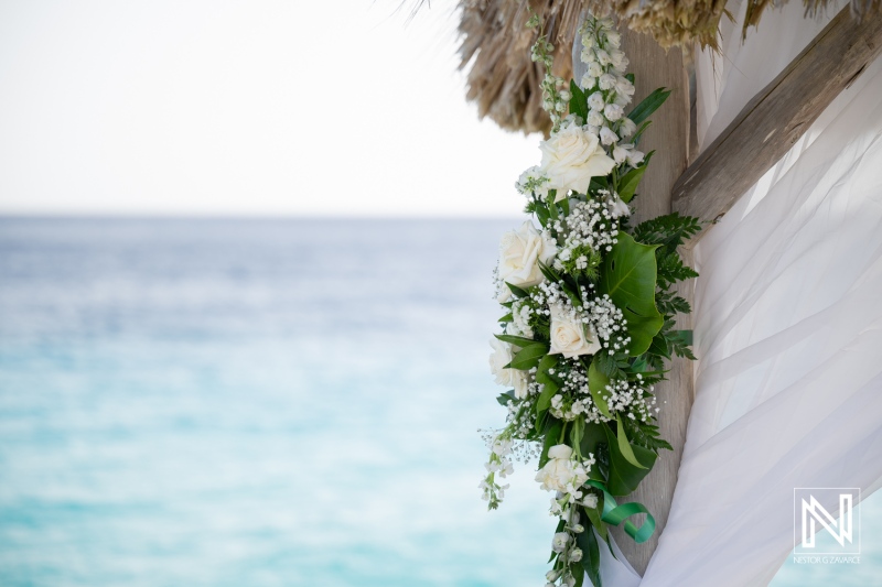 Beautiful wedding decorations at Karakter, Curacao with ocean views and floral arrangements