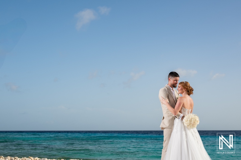 Couple celebrates their wedding by the ocean at Karakter in Curacao with a beautiful backdrop and warm weather