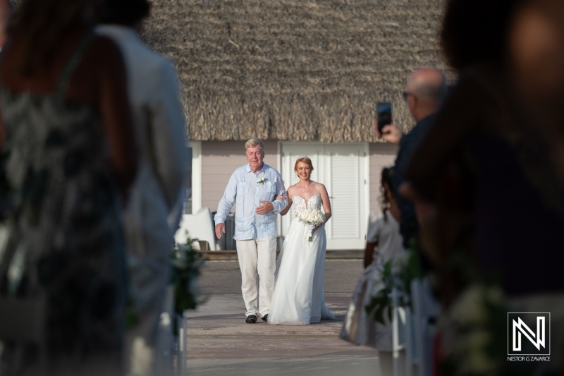 Couple celebrates their wedding ceremony at Karakter in Curacao, enjoying a beautiful day by the beach with family and friends