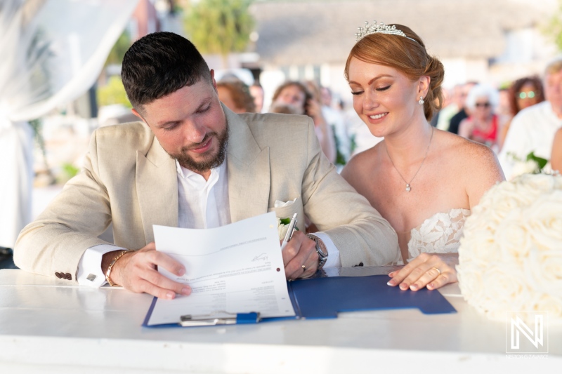 Couple signs their marriage certificate during a beautiful wedding ceremony at Karakter in Curacao