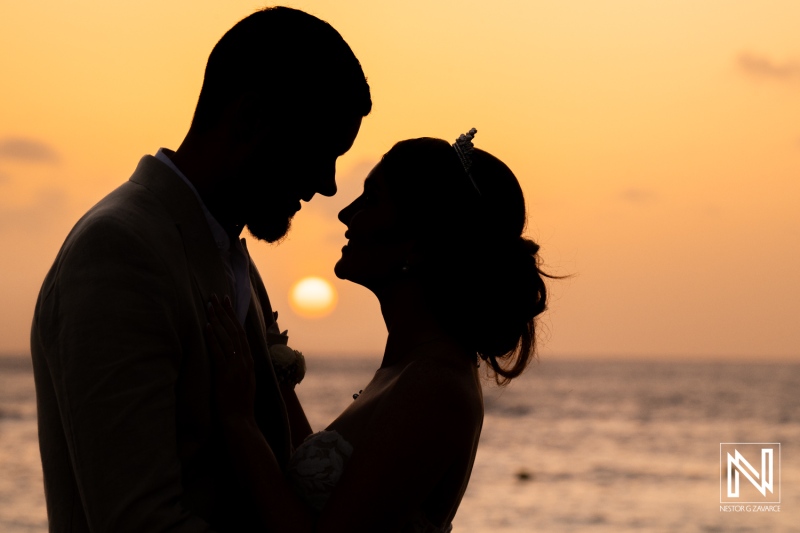 Romantic wedding silhouette at sunset in Curacao near Karakter beach