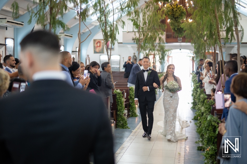 Bride walking down the isle with her dad