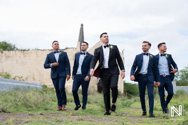 Groom and groomsmen walking at their photo session
