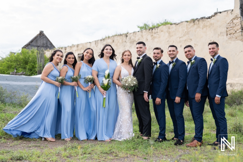 Bride and groom with wedding party at the photo session