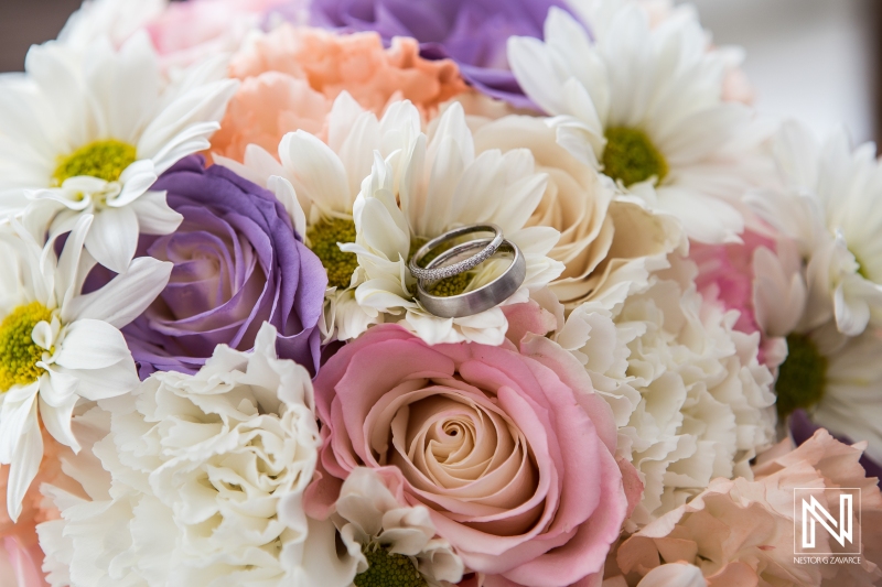 Wedding rings on the bride bouquet