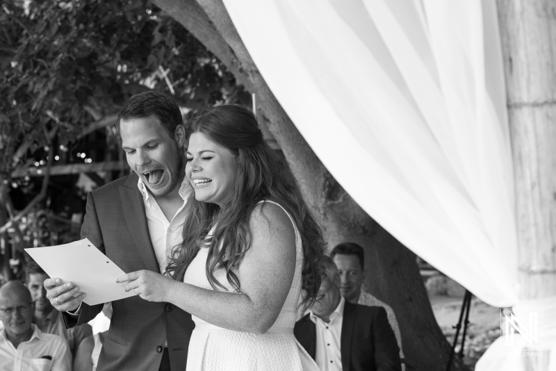 Bride and groom reading their  wedding document