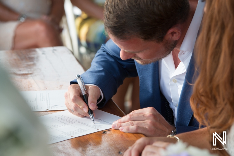 Groom signing the wedding document