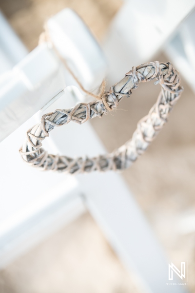 Beach wedding chair decor with wood heart