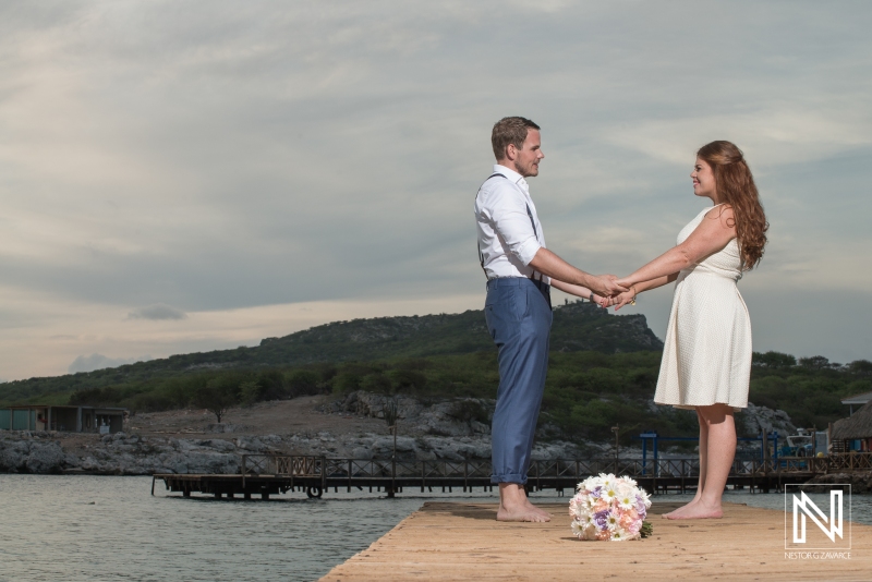 Bride and groom photoshoot on the beach pier