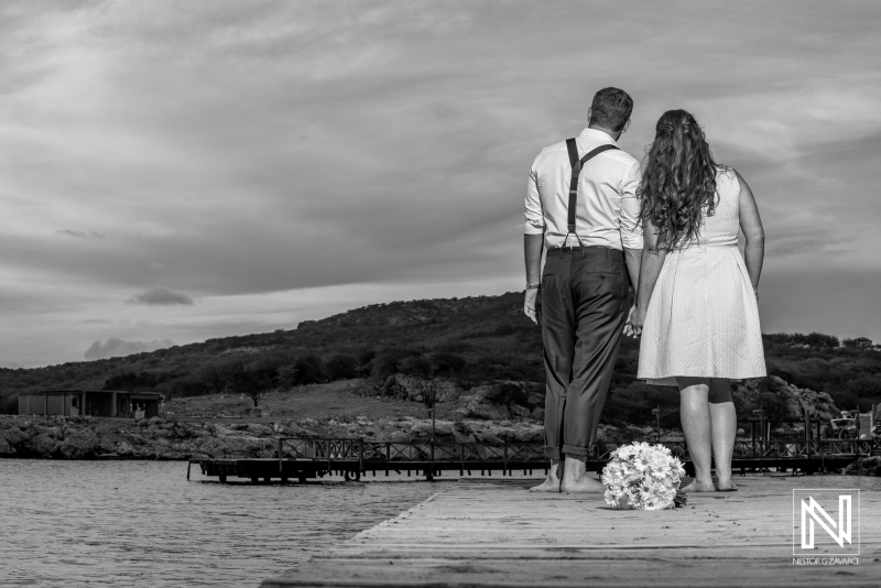 Bride and groom photoshoot on the beach pier