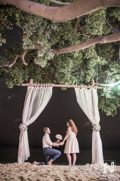 Bride and groom photoshoot with the beach wedding gazebo