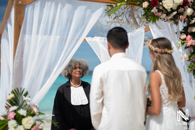 Bride and groom listening to the officiant speech