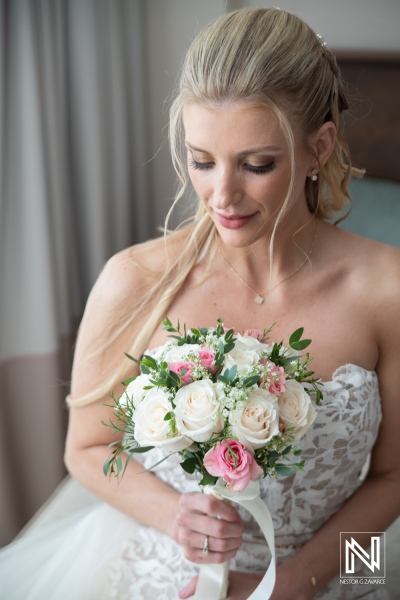 Bride holding flower bouquet at wedding ceremony in Dreams Curacao Resort