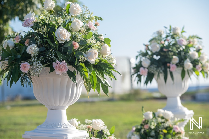 Beautiful wedding setup at Dreams Curacao Resort with floral arrangements and greenery