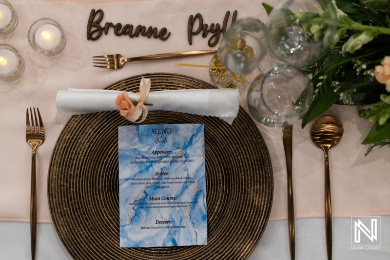 Wedding setup at Dreams Curaçao Resort featuring menus and place settings