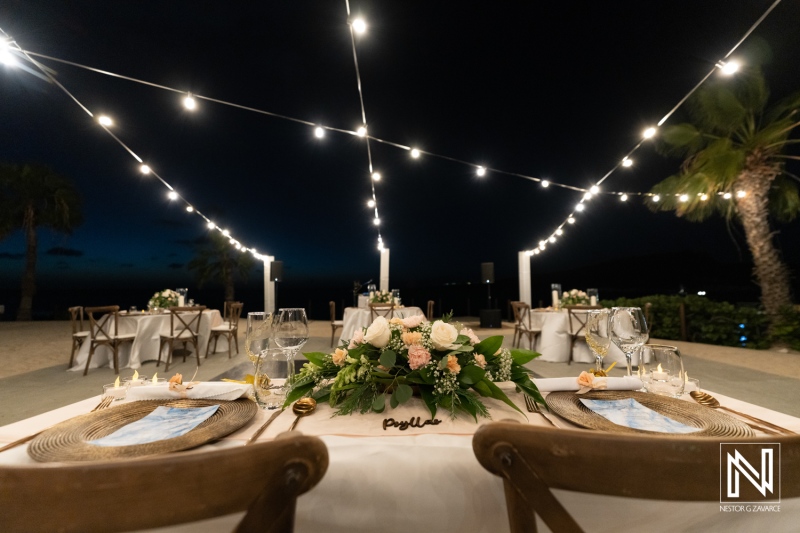 Wedding setup at Dreams Curacao Resort with tables and lights in evening setting