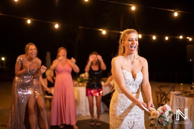 Celebration of love at a wedding in Dreams Curacao Resort with the bride catching the bouquet amidst joyful friends