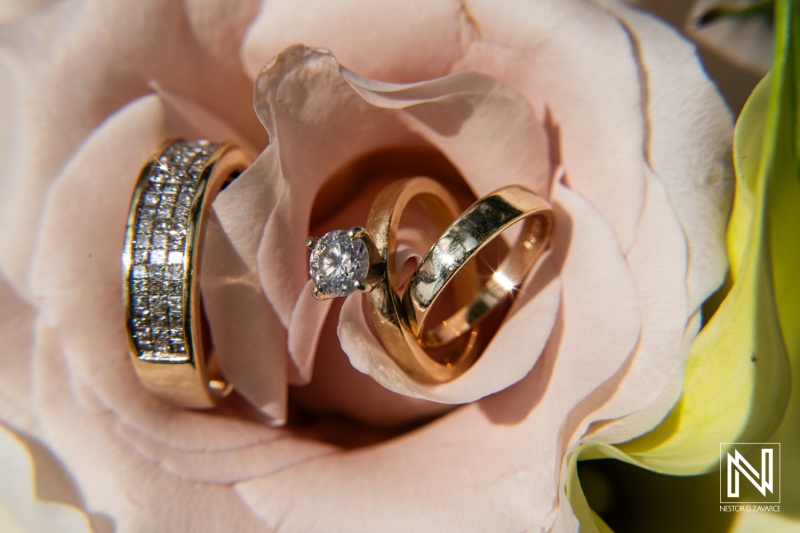 Rings beautifully displayed on a delicate flower at a Curacao wedding held at Sunscape Curaçao Resort