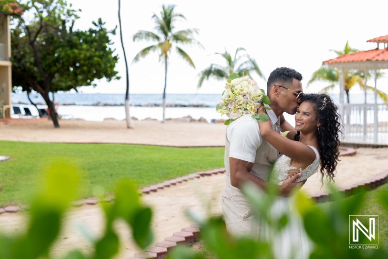 Romantic wedding celebration at Sunscape Curacao Resort with beautiful couple enjoying a sunny moment by the beach