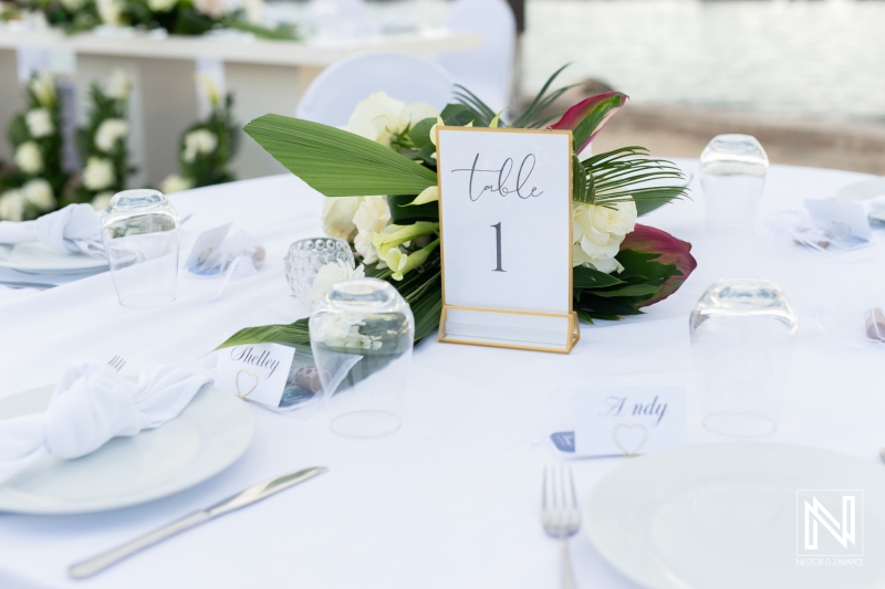 Romantic wedding table setup at Sunscape Curacao Resort with tropical flowers and elegant decor