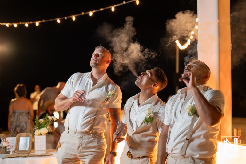 Celebratory moment at a Curacao wedding with friends enjoying cigars at Sunscape Curacao Resort