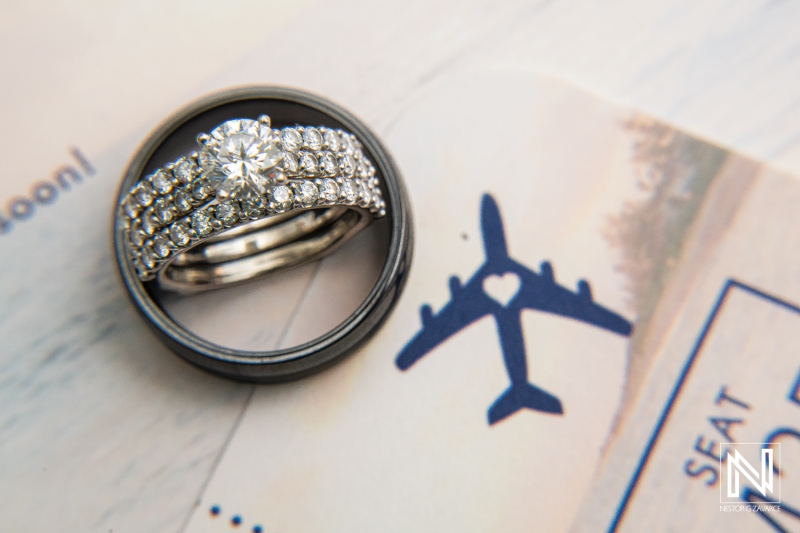 Stunning wedding rings combined with travel theme captured during a sunset celebration at Avila Beach Hotel, Curacao