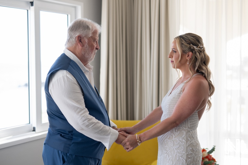 Intimate wedding ceremony at Avila Beach Hotel in Curacao during a stunning sunset glow