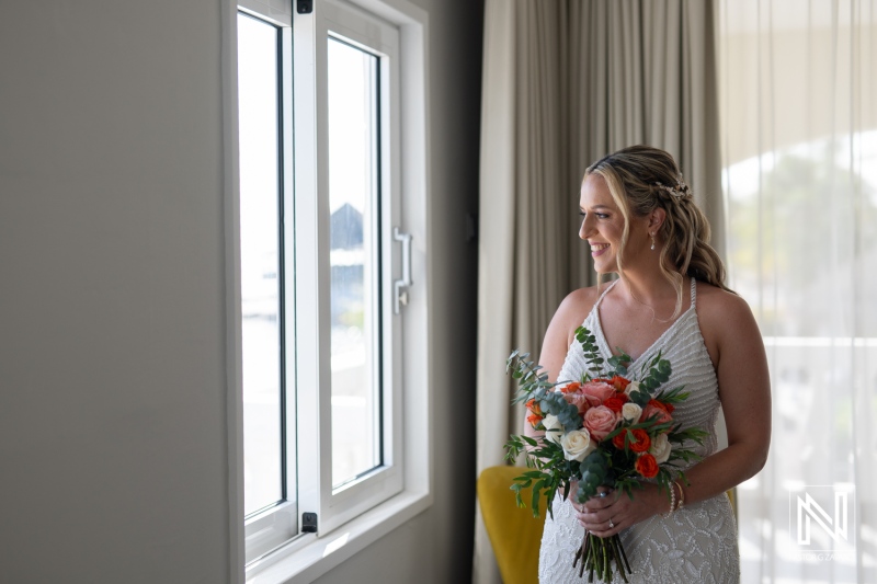 Bride prepares for sunset wedding at Avila Beach Hotel in Curacao surrounded by love and beauty