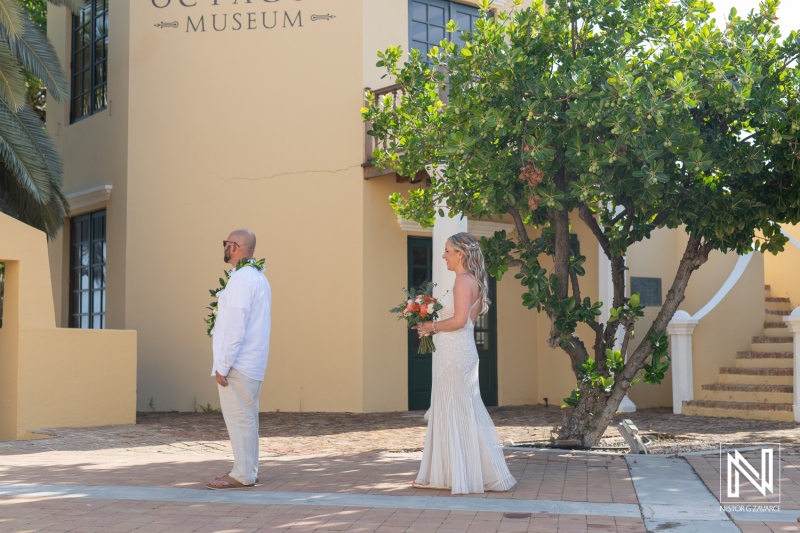 Beautiful wedding ceremony at Avila Beach Hotel in Curacao during a breathtaking sunset with an intimate atmosphere and stunning surroundings for the couple